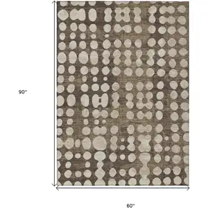 Photo of Brown And Beige Abstract Washable Indoor Outdoor Area Rug