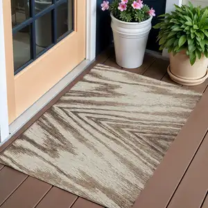 Photo of Brown And Beige Abstract Washable Indoor Outdoor Area Rug