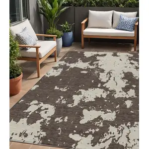 Photo of Brown And Beige Abstract Washable Indoor Outdoor Area Rug