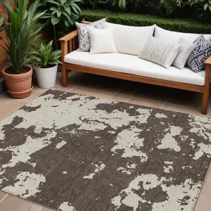 Photo of Brown And Beige Abstract Washable Indoor Outdoor Area Rug