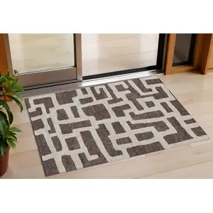 Photo of Brown And Beige Abstract Washable Indoor Outdoor Area Rug
