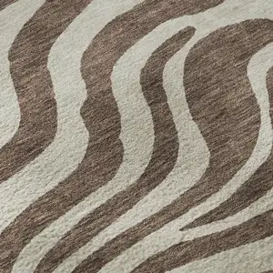 Photo of Brown And Beige Animal Print Washable Area Rug With UV Protection