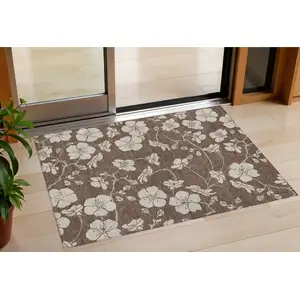 Photo of Brown And Beige Floral Washable Indoor Outdoor Area Rug