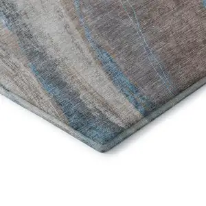 Photo of Brown And Blue Abstract Washable Area Rug With UV Protection