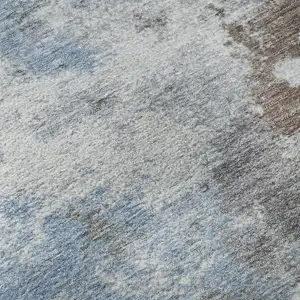 Photo of Brown And Blue Abstract Washable Area Rug With UV Protection