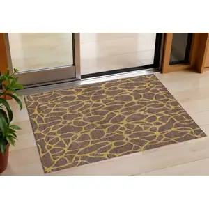 Photo of Brown And Gold Geometric Washable Indoor Outdoor Area Rug
