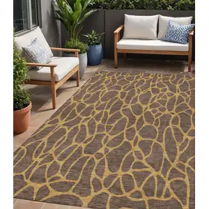 Photo of Brown And Gold Geometric Washable Indoor Outdoor Area Rug