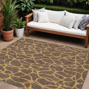 Photo of Brown And Gold Geometric Washable Indoor Outdoor Area Rug