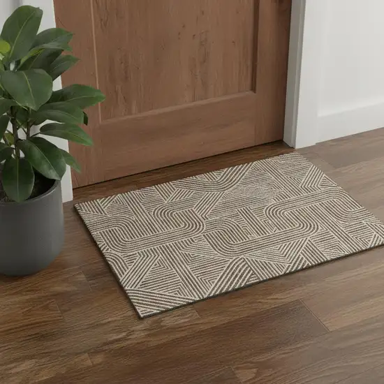 Brown And Ivory Abstract Geometric Washable Area Rug With UV Protection Photo 1