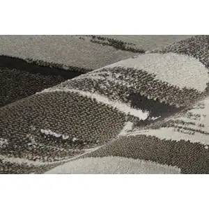 Photo of Brown And Ivory Abstract Power Loom Distressed Stain Resistant Area Rug