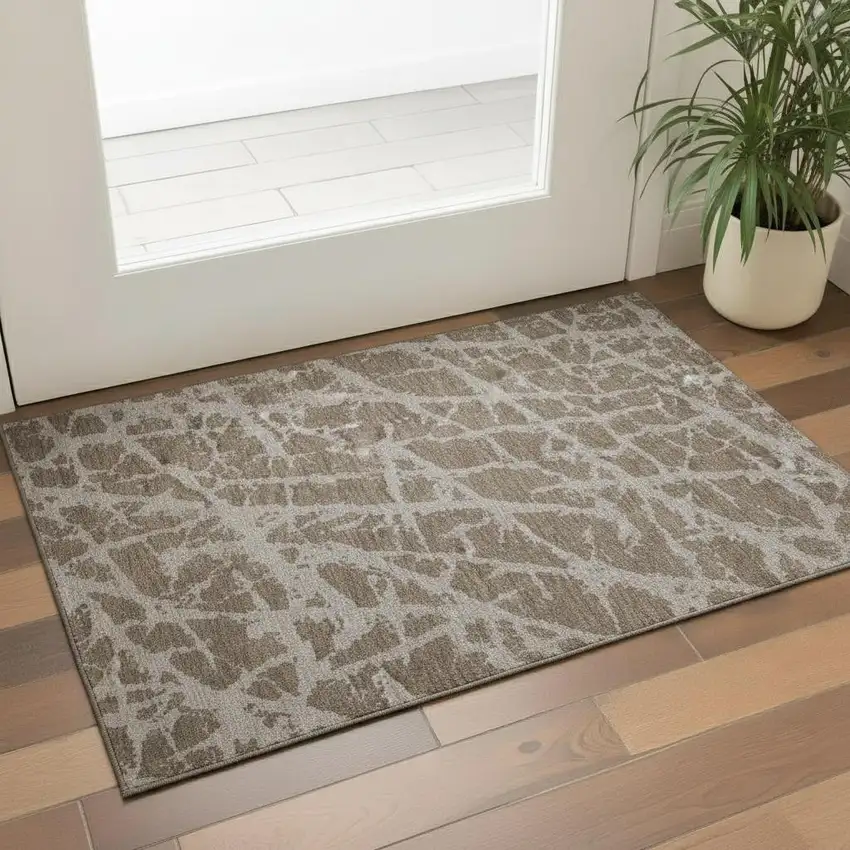 Brown And Ivory Abstract Washable Area Rug With UV Protection Photo 1