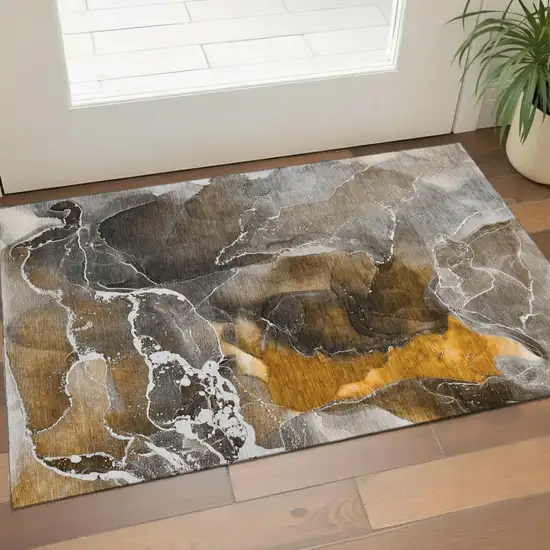 Brown And Ivory Abstract Washable Area Rug With UV Protection Photo 1