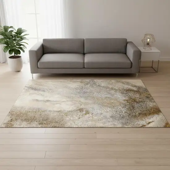 Brown And Ivory Abstract Washable Area Rug With UV Protection Photo 1
