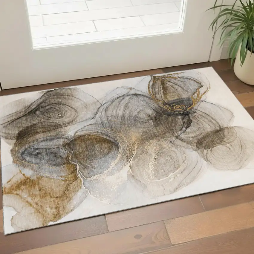 Brown And Ivory Abstract Washable Area Rug With UV Protection Photo 1