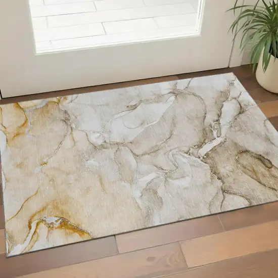 Brown And Ivory Abstract Washable Area Rug With UV Protection Photo 1