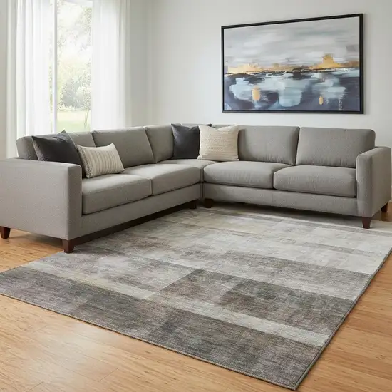 Brown And Ivory Abstract Washable Area Rug With UV Protection Photo 1