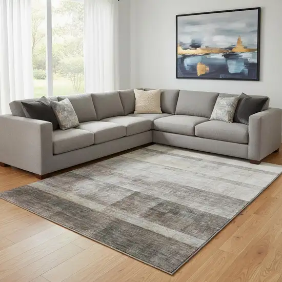 Brown And Ivory Abstract Washable Area Rug With UV Protection Photo 1