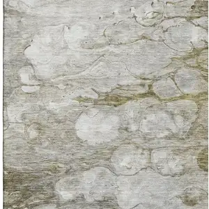 Photo of Brown And Ivory Abstract Washable Area Rug With UV Protection