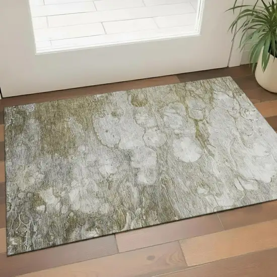 Brown And Ivory Abstract Washable Area Rug With UV Protection Photo 1