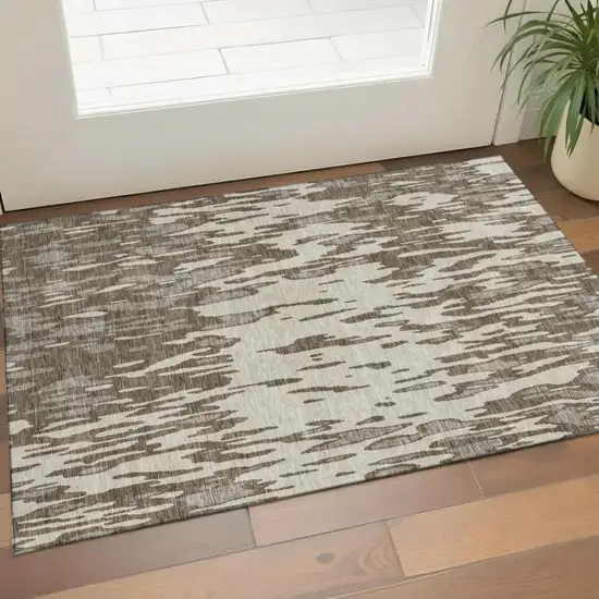 Brown And Ivory Abstract Washable Area Rug With UV Protection Photo 1
