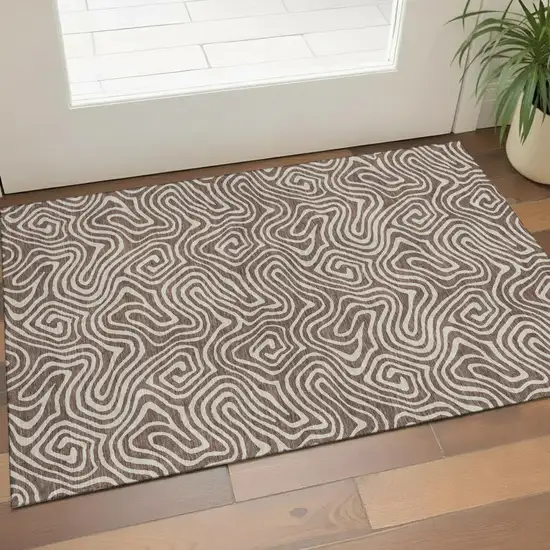 Brown And Ivory Abstract Washable Area Rug With UV Protection Photo 1