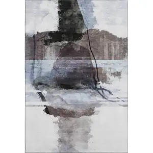 Photo of Brown And Ivory Abstract Washable Area Rug With UV Protection