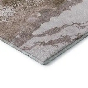 Photo of Brown And Ivory Abstract Washable Area Rug With UV Protection