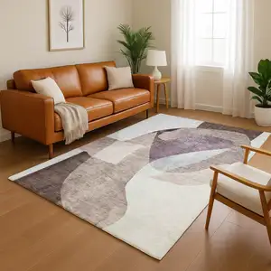 Photo of Brown And Ivory Abstract Washable Area Rug With UV Protection