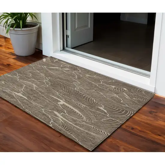 Brown And Ivory Abstract Washable Indoor Outdoor Area Rug Photo 1