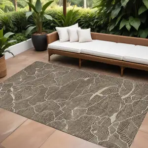 Photo of Brown And Ivory Abstract Washable Indoor Outdoor Area Rug