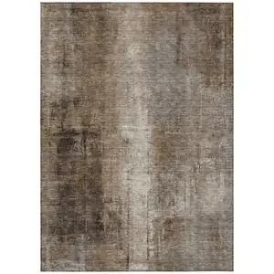 Photo of Brown And Ivory Abstract Washable Indoor Outdoor Area Rug