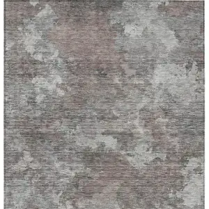 Photo of Brown And Ivory Abstract Washable Indoor Outdoor Area Rug