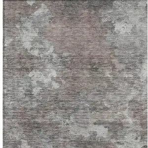 Photo of Brown And Ivory Abstract Washable Indoor Outdoor Area Rug