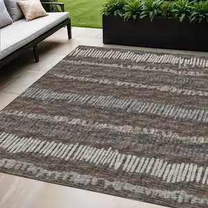 Photo of Brown And Ivory Abstract Washable Indoor Outdoor Area Rug