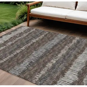 Photo of Brown And Ivory Abstract Washable Indoor Outdoor Area Rug