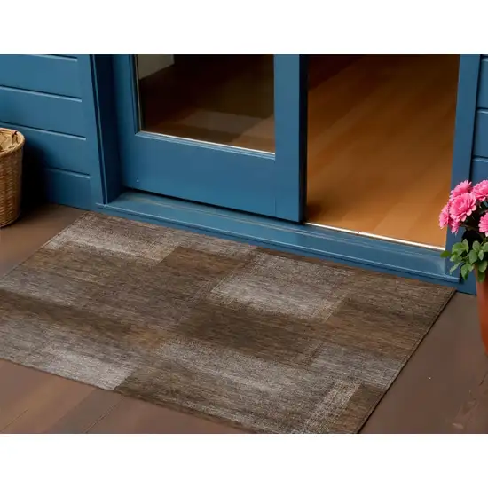 Brown And Ivory Abstract Washable Indoor Outdoor Area Rug Photo 1