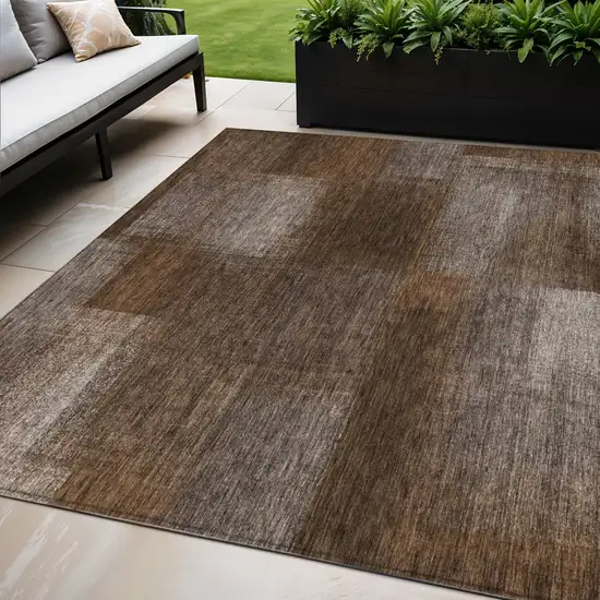 Brown And Ivory Abstract Washable Indoor Outdoor Area Rug Photo 1