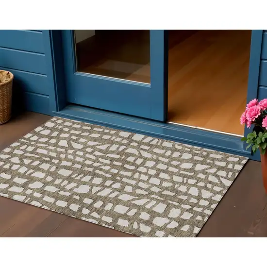 Brown And Ivory Abstract Washable Indoor Outdoor Area Rug Photo 1