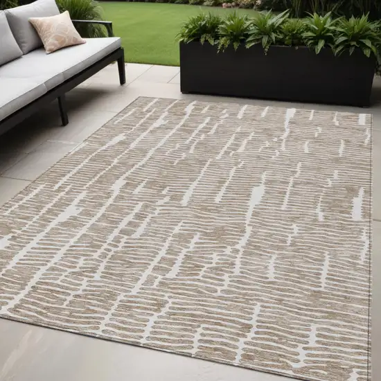 Brown And Ivory Abstract Washable Indoor Outdoor Area Rug Photo 1