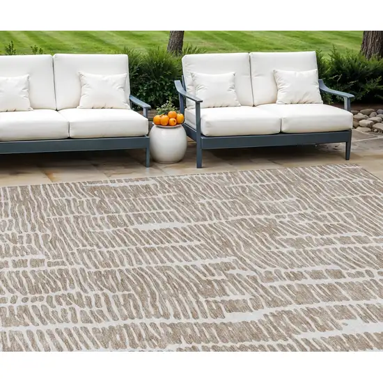 Brown And Ivory Abstract Washable Indoor Outdoor Area Rug Photo 1