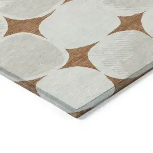 Photo of Brown And Ivory Abstract Washable Indoor Outdoor Area Rug