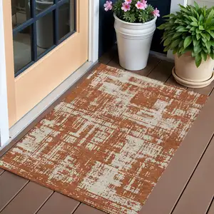 Photo of Brown And Ivory Abstract Washable Indoor Outdoor Area Rug
