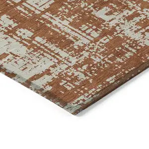 Photo of Brown And Ivory Abstract Washable Indoor Outdoor Area Rug