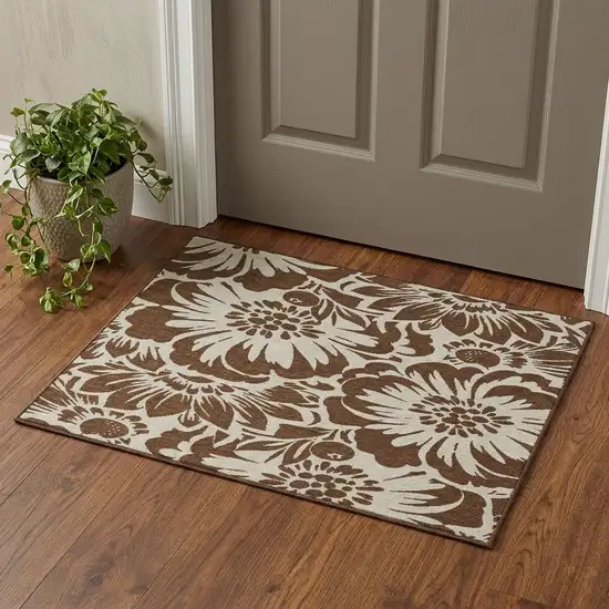 Brown And Ivory Floral Washable Area Rug With UV Protection Photo 1