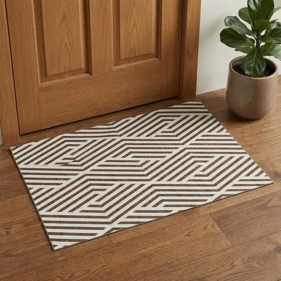 Brown And Ivory Geometric Washable Area Rug With UV Protection Photo 1