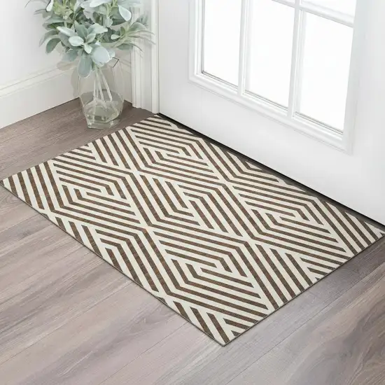 Brown And Ivory Geometric Washable Area Rug With UV Protection Photo 1