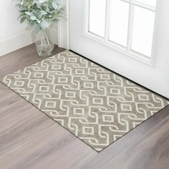 Brown And Ivory Geometric Washable Area Rug With UV Protection Photo 1