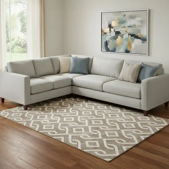 Brown And Ivory Geometric Washable Area Rug With UV Protection Photo 1