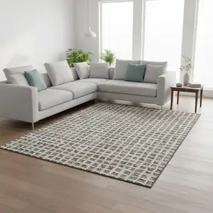 Photo of Brown And Ivory Geometric Washable Area Rug With UV Protection