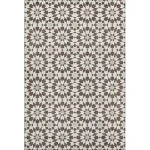 Photo of Brown And Ivory Geometric Washable Area Rug With UV Protection